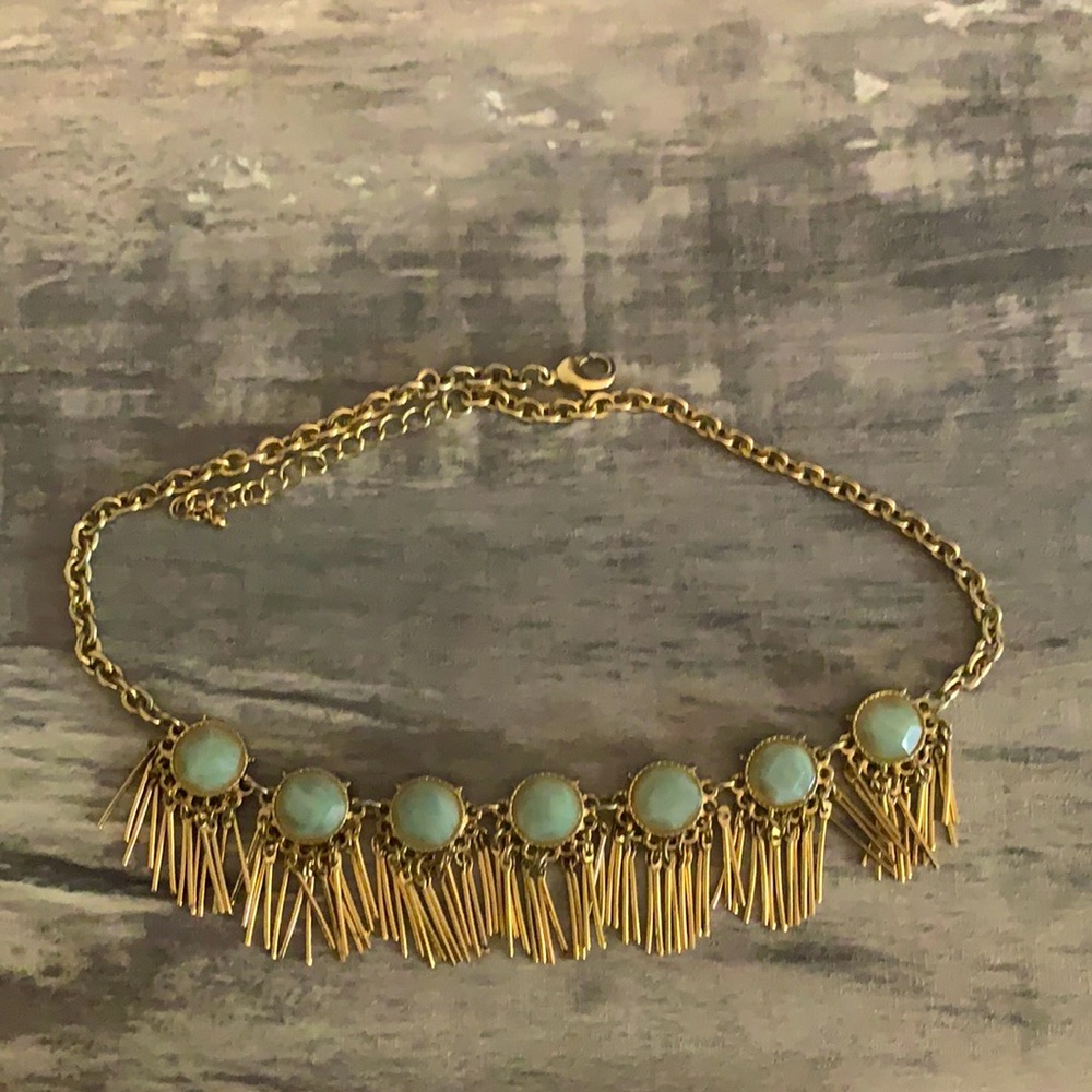 Gold necklace with green beads